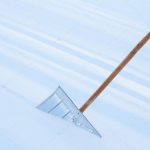 depositphotos 101770448 stock photo snowshovel in the snowdrift closeup