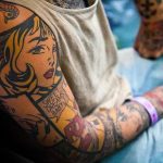 man with amazing pop art full tattoo sleeve
