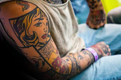 man with amazing pop art full tattoo sleeve