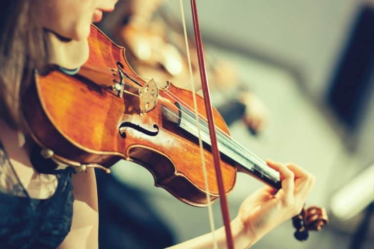 playing the violin 765x510
