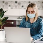 coronavirusbusinesswomanworkinghomewearingprotectivemaskquarantine18073155 2e9b14aa30e0624412cb429a40eedbdf