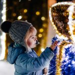 child looking at the new year s festive decoration 2022 11 11 07 52 19 utc