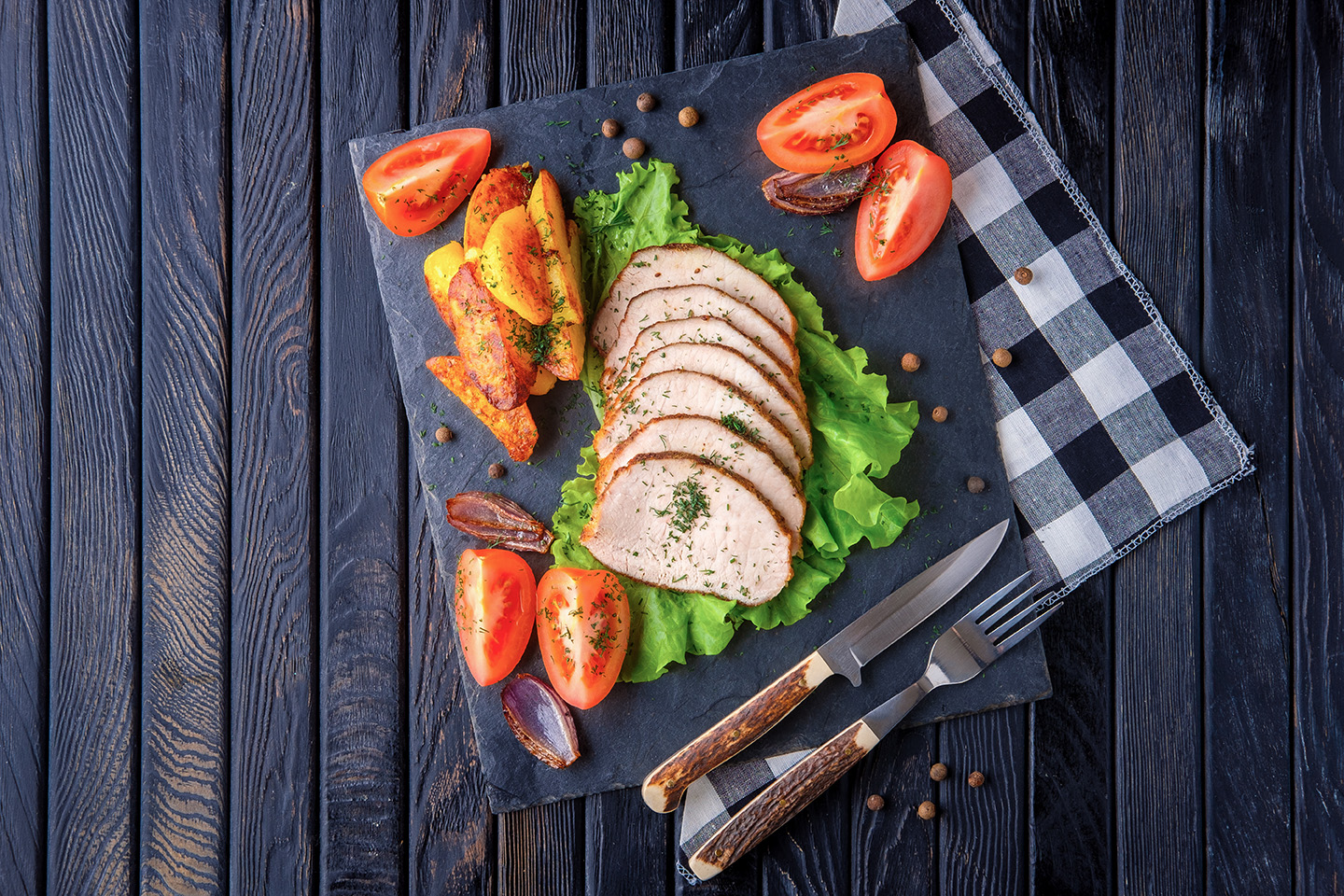 sliced baked ham with fresh tomatoes on a stone pl 2022 04 01 19 59 34 utc