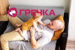 a man with a child playing
