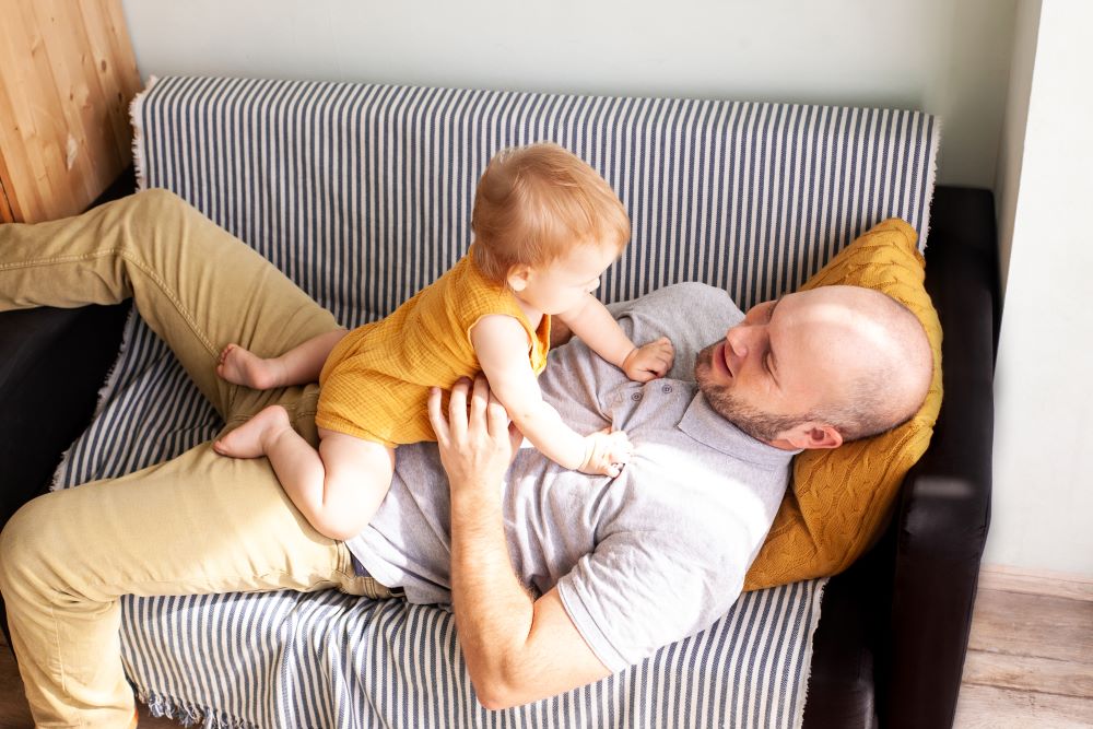 a man with a child playing