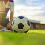 sport man tying shoes wit
