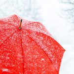 close up of red umbrella in snow copy copy