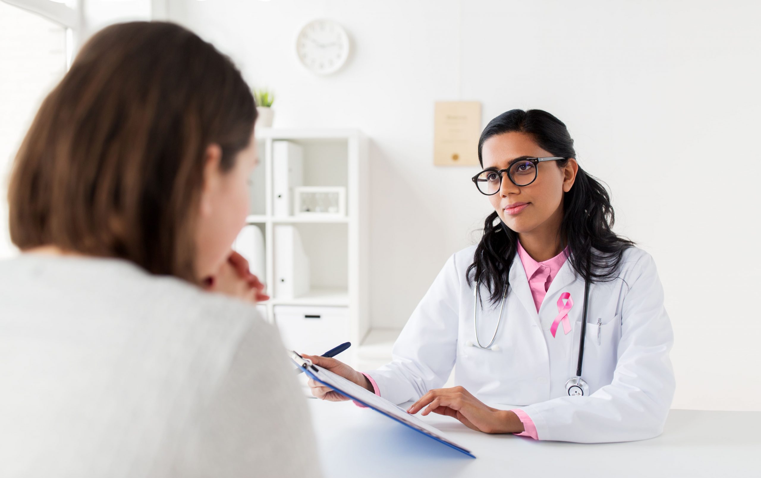 doctor with pink awareness ribbon and patient 2022 12 16 09 49 07 utc 1